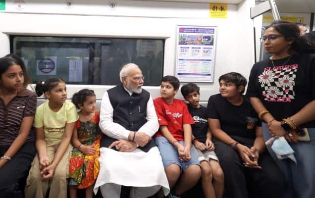 PM Modi takes Delhi Metro to SRCC, chats with students on way to centenary event